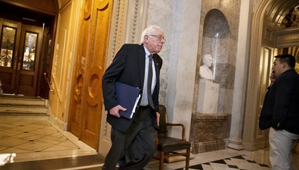 Sen. Bernie Sanders, I-Vt., rushes off the floor after a vote to cut off debate on the Keystone XL pipeline bill fell short, at the Capitol in Washington, Monday, Jan. 26, 2015. (AP Photo/J. Scott Applewhite)