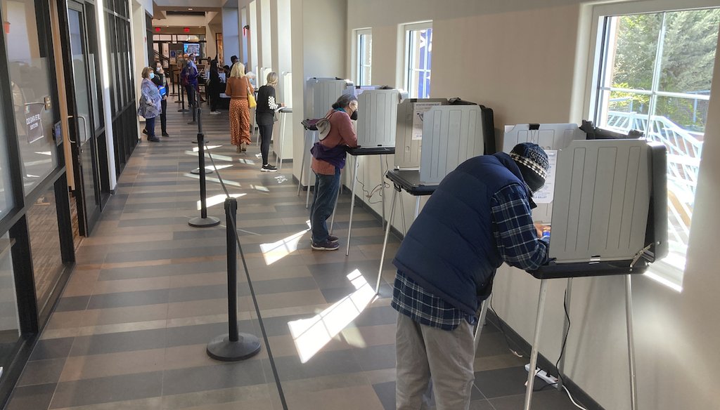 Santa Fe County residents fill out general election ballots during the first day of general election voting on Tuesday, Oct. 11, 2022, in a hallway outside the Santa Fe County clerk's office in Santa Fe, N.M. (AP)