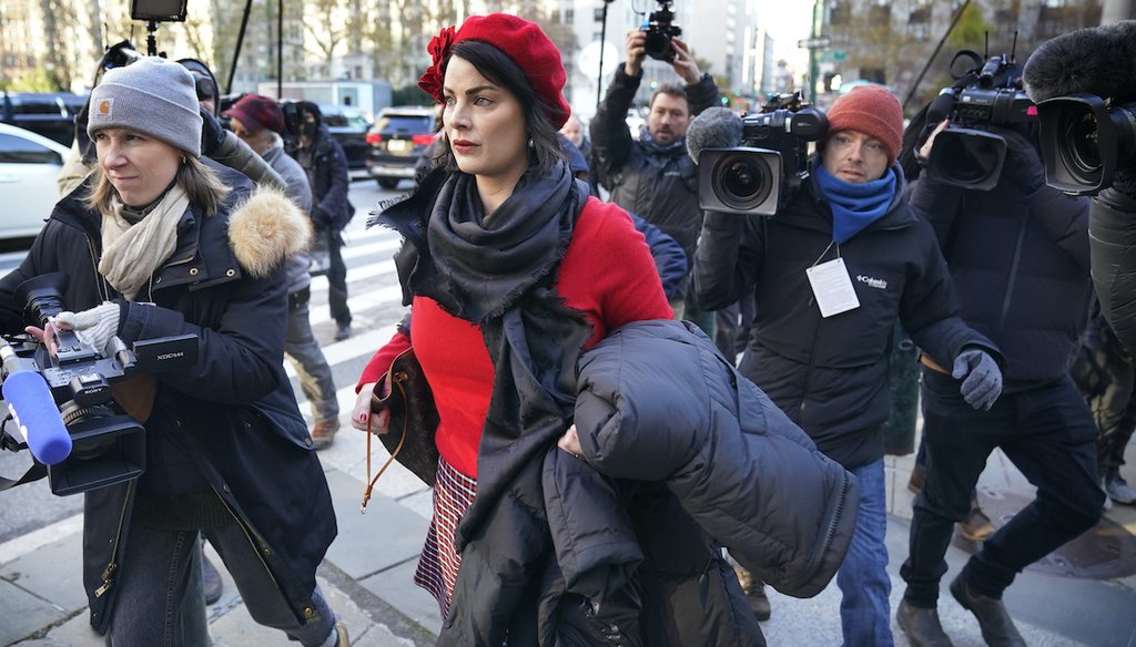 Sarah Ransome, an alleged victim of Jeffrey Epstein and Ghislaine Maxwell, is surrounded by journalists as she arrives at the courthouse for the start of Maxwell's trial in New York, Monday, Nov. 29, 2021. (AP)