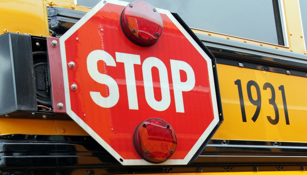 A small white camera on a Cobb County School bus can capture video of violators who pass a stopped bus. Photo by Phil Skinner / AJC