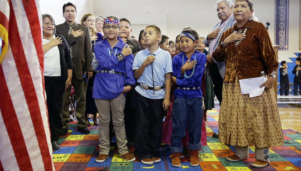 In this Sept. 26, 2014 file photo, students and faculty recite the "Pledge of Allegiance" during an assembly at the Crystal Boarding School in Crystal, N.M., on the Navajo Nation. (AP)