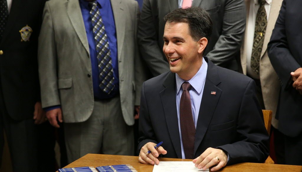 Gov. Scott Walker, shown here at a bill signing ceremony, was part of all five top-clicked items from June. (Milwaukee Journal Sentinel photo by Mike DeSisti)