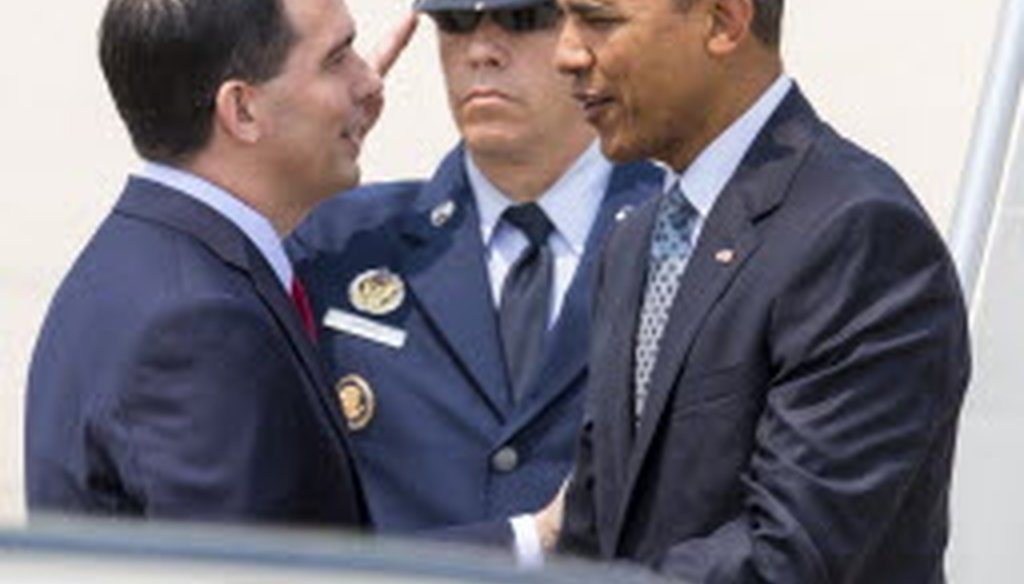 Gov. Scott Walker greeted President Barack Obama when Obama arrived at an airport in La Crosse, Wis., on July 2, 2015. (AP photo)