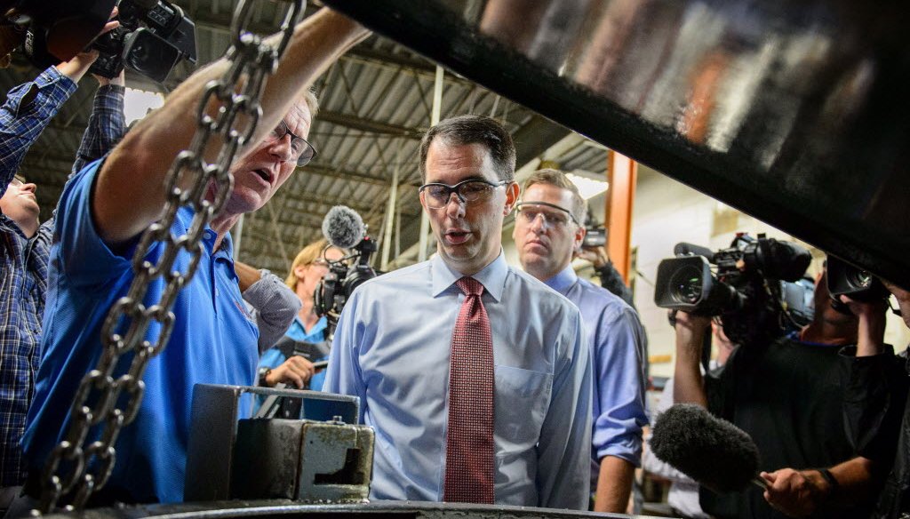 Campaigning for president, Wisconsin Gov. Scott Walker toured Cass Screw Machine in Brooklyn Center, Minn. on Aug. 18, 2015 and announced his plan to replace Obamacare. (AP photo)