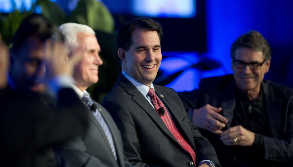Talk of Wisconsin Gov. Scott Walker running for president grew during the annual meetings of the Republican Governors Association in November 2014. Walker is shown with GOP Governors Mike Pence of Indiana (left) and Texas Gov. Rick Perry. (AP photo)