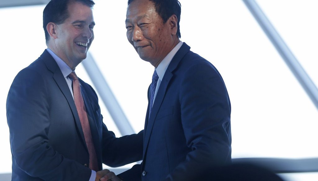 Wisconsin Gov. Scott Walker (left) and Foxconn chairman Terry Gou have struck a multi-billion deal to bring a manufacturing plant to Wisconsin. Some question whether the state is offering too much in incentives. (Mike De Sisti/Milwaukee Journal Sentinel)