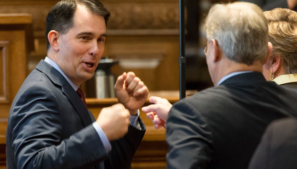Republican Wisconsin Gov. Scott Walker (left) playfully spars with Assembly Minority Leader Peter Barca, a Democrat, after delivering his 2017-'19 budget address on Feb. 8, 2017. (Milwaukee Journal Sentinel/Mark Hoffman)