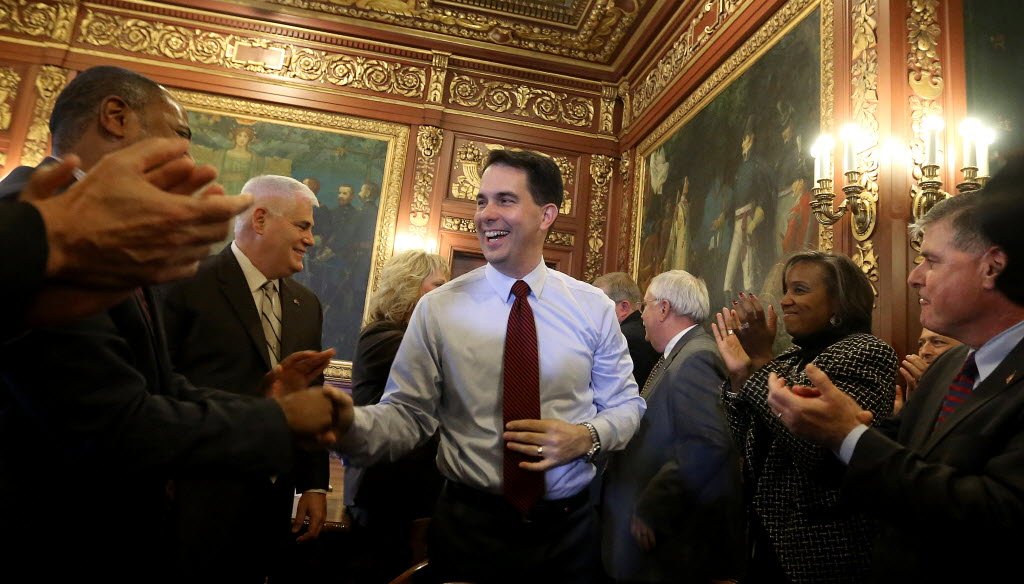 Wisconsin Gov. Scott Walker met with his Cabinet on Nov. 5, 2014, the day after he won re-election to a second term. Walker hasn't discouraged speculation that he might run for the Republican nomination for president in 2016.