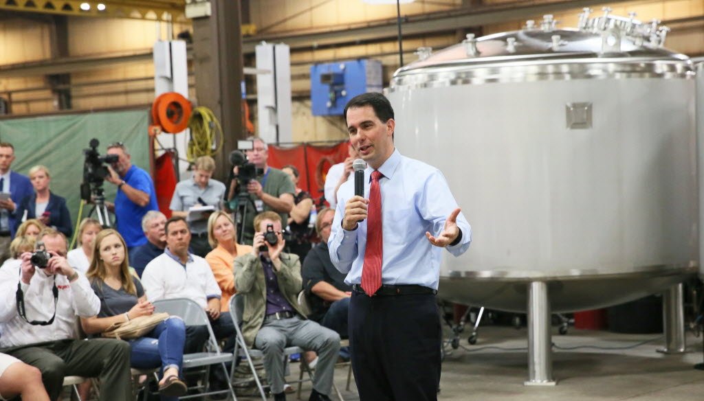 Gov. Scott Walker spoke to employees at Apache Stainless Equipment Corp. in Beaver Dam, Wis., before talking to reporters about his support for a proposal to overhaul Wisconsin's civil service system for state employees. (Michael Sears photo)