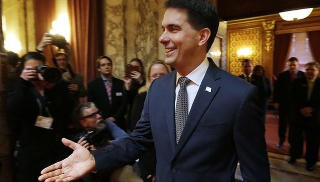 Gov. Scott Walker shook hands with lawmakers before making his annual state of the state speech on Jan. 10, 2017. The speech touted his property tax cuts.  (Milwaukee Journal Sentinel/Rick Wood)