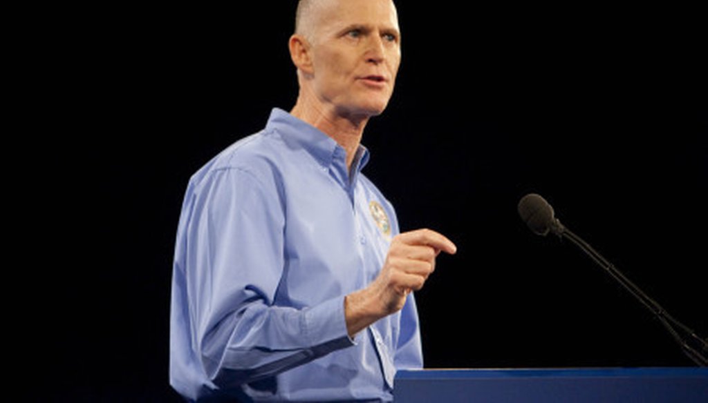 Florida Gov. Rick Scott delivers the keynote address at Florida's Presidency 5 meeting.