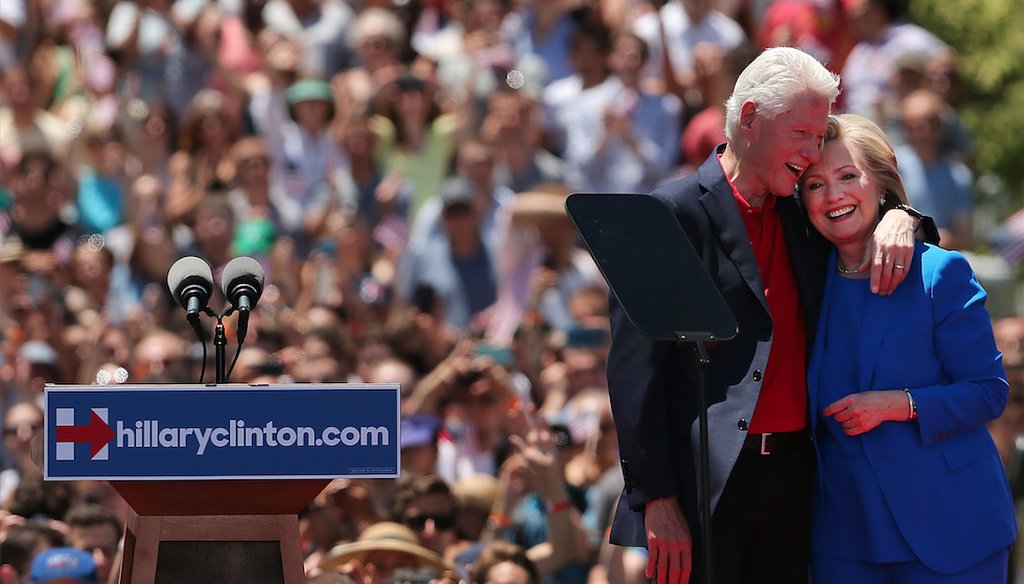 Democratic presidential candidate Hillary Rodham Clinton stands on stage with her husband, former President Bill Clinton, after her official kickoff rally June 13, 2015, in New York City. (Photo by Spencer Platt/Getty Images) 