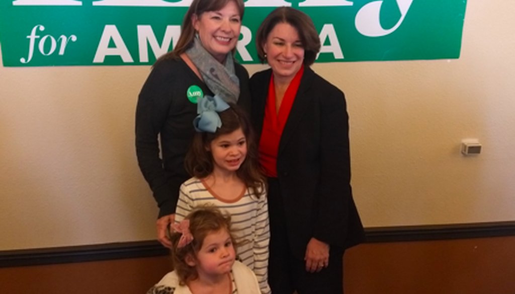 Amy Klobuchar poses with Iowa voters in a selfie line after an appearance in Waterloo, Iowa, on Jan. 26, 2020. (Louis Jacobson/PolitiFact)