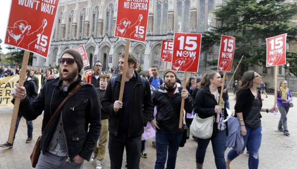 Students and other supporters protest on the University of Washington campus in Seattle in support of raising the minimum wage for campus workers to $15 an hour on April 1, 2015. (AP/Ted S. Warren) 