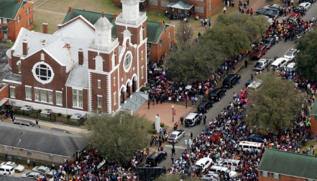 Thousands of people line up outside Brown Chapel African Methodist Episcopal Church in Selma, Ala., to begin a symbolic walk across the Edmund Pettus Bridge, on the 50th anniversary of "Bloody Sunday."