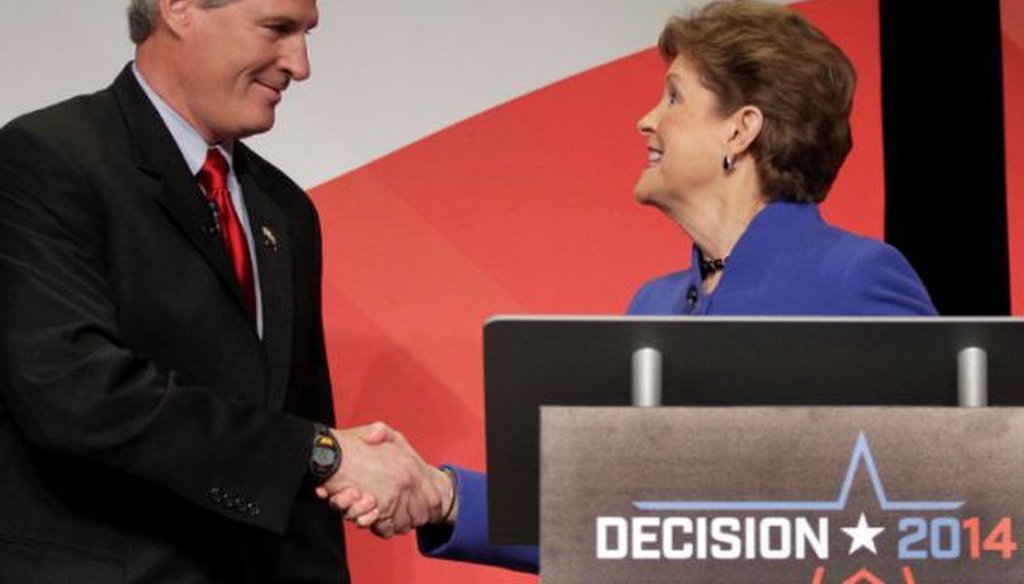 Republican Scott Brown and Democratic Sen. Jeanne Shaheen shake hands during a debate on Oct. 21, 2014.