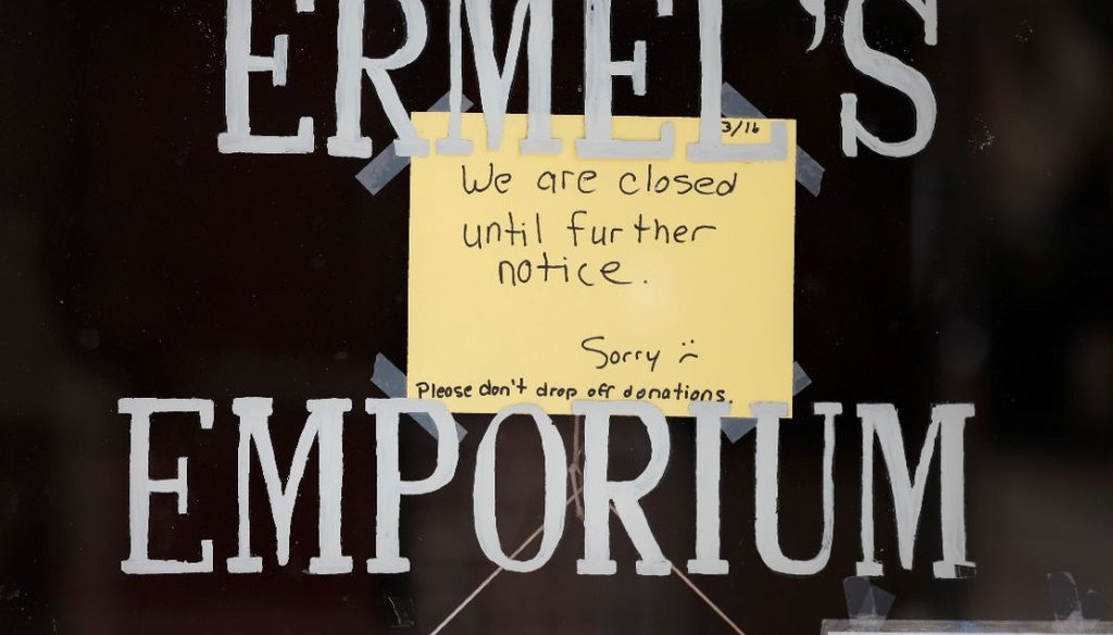 A sign hangs on the front door of a store shuttered store due to efforts to fend off coronavirus, in Central City, Colo., on March 17, 2020. (AP)
