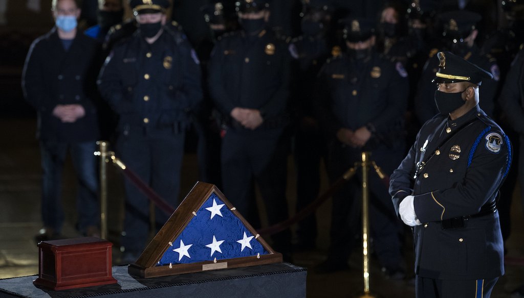 U.S. Capitol Police officers pay their respects to the late U.S. Capitol Police officer Brian Sicknick as an urn with his cremated remains lies in honor in the Capitol Rotunda. (Brendan Smialowski/AP)