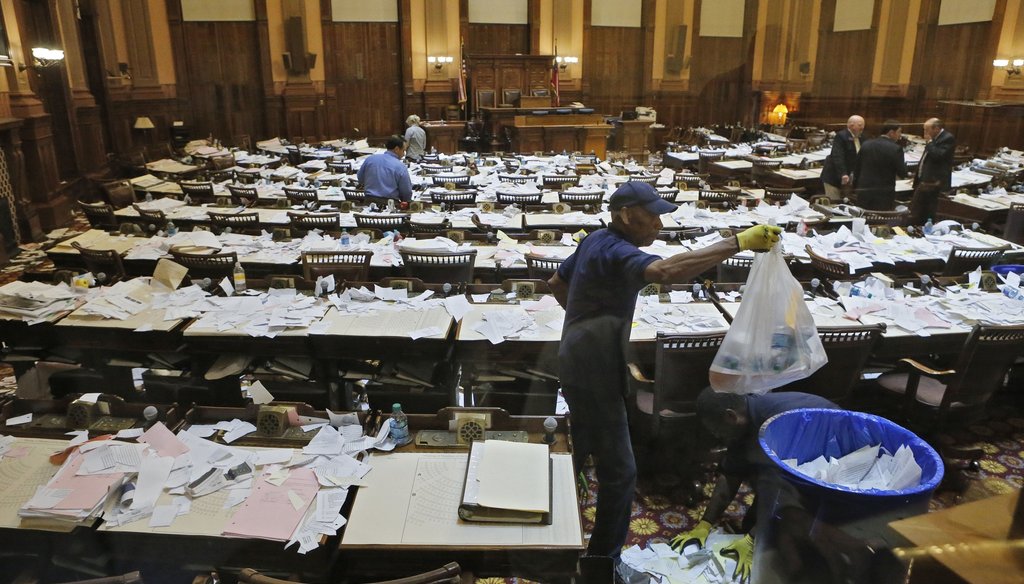 Workers clean up after the House adjourned for 2015 Legislative session. Photo by Bob Andres / AJC