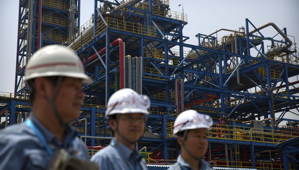 Workers at the Sinopec Yanshan Petrochemical Company on the outskirts of Beijing in 2018. The facility is part of the Chinese state-owned oil giant Sinopec. (AP)