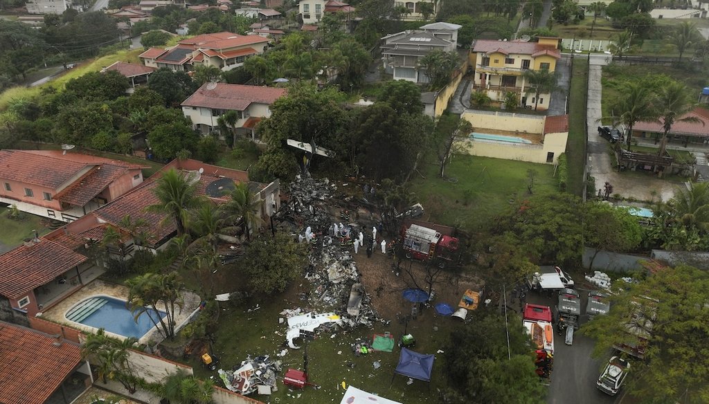 Firefighters and rescue teams work at the site in a residential area where an airplane crashed the previous day in Vinhedo, Sao Paulo state, Brazil, Aug. 10, 2024. (AP)