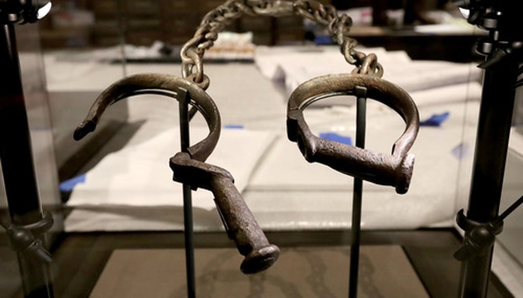 A pair of slave shackles are on display in the Slavery and Freedom Gallery in the Smithsonian's National Museum of African American History and Culture in Washington, D.C. in September 2016. (Getty Images)