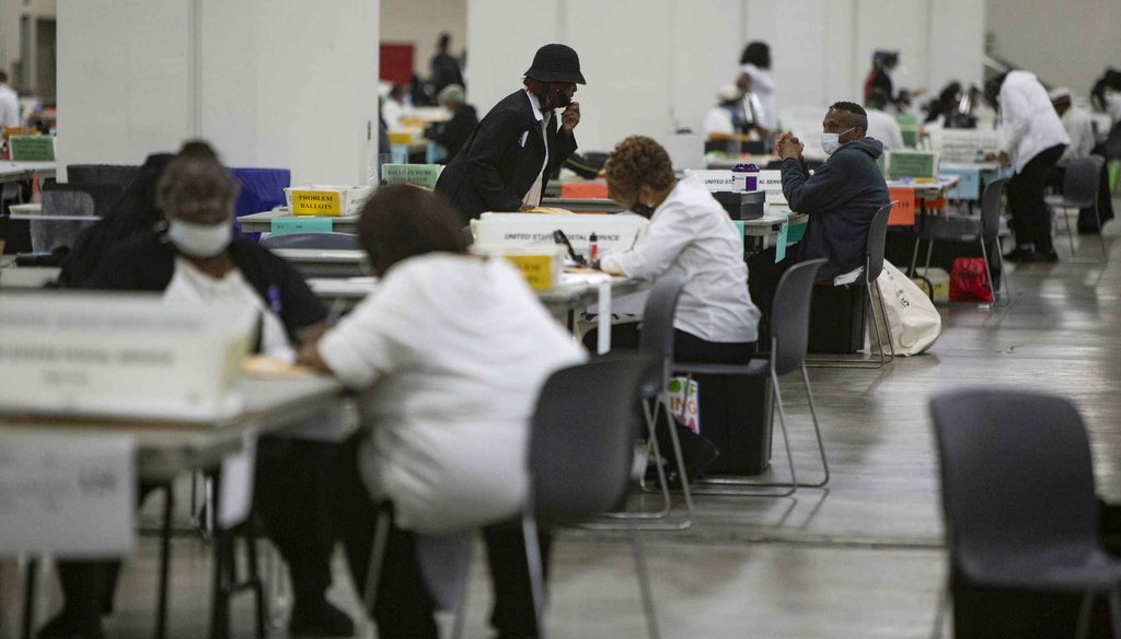 Detroit election workers count absentee ballots cast in the primary election on Aug. 4, 2020, at the TCF Center in Detroit. (Mandi Wright, Detroit Free Press)