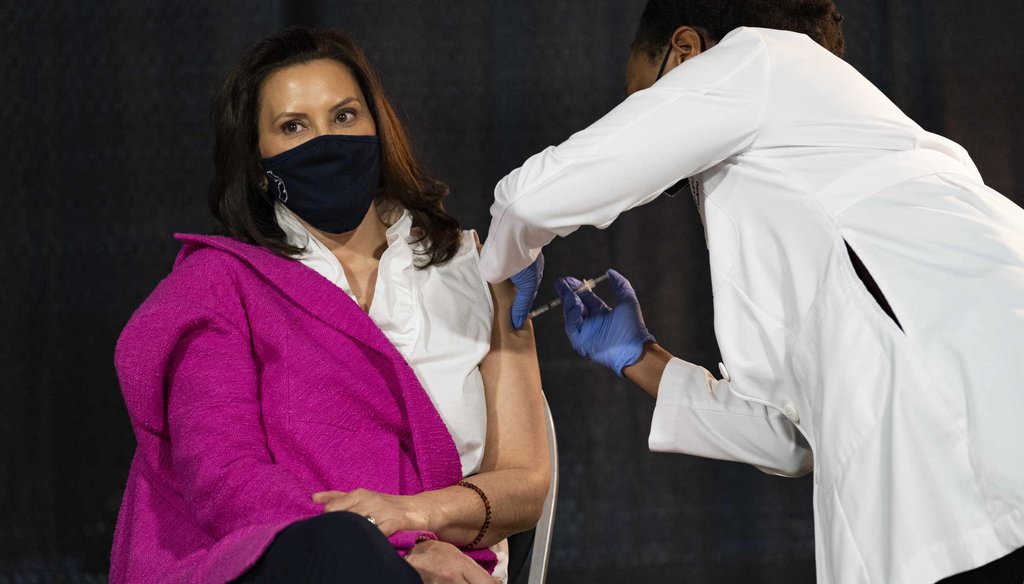 Michigan Gov. Gretchen Whitmer gets her first COVID-19 vaccine dose Apr. 6, 2021, at Ford Field in Detroit, administered by Michigan Chief Medical Executive Dr. Joneigh S. Khaldun. (Mandi Wright, Detroit Free Press)