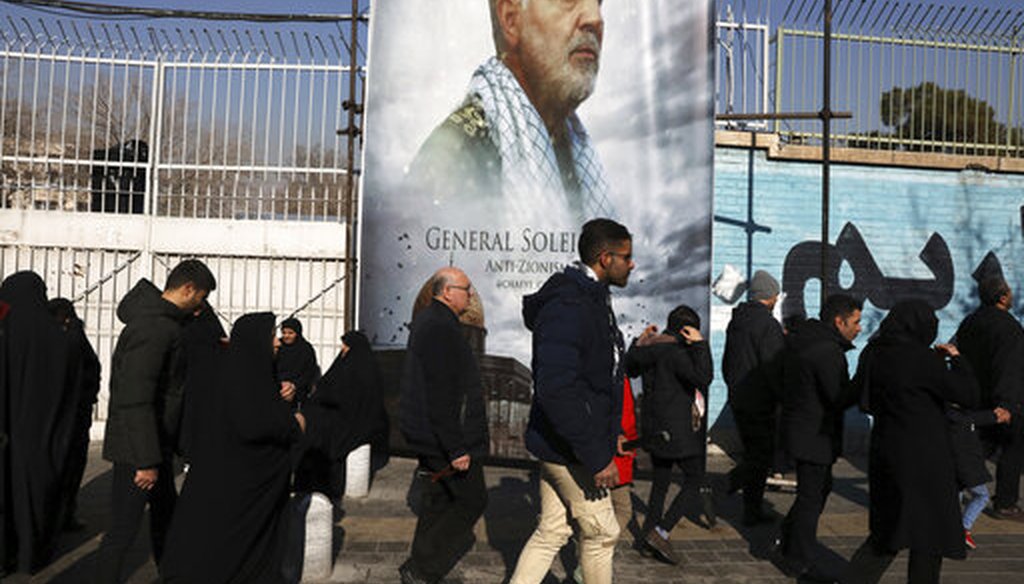 Mourners walk back from a funeral ceremony for Iranian Gen. Qassem Soleimani in front of the former U.S. Embassy, in Tehran. (AP Photo/Vahid Salemi)