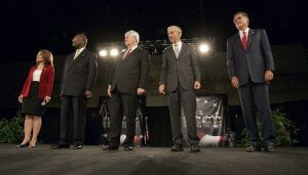 Republican presidential candidates Michele Bachmann, Herman Cain, Newt Gingrich, Ron Paul and Mitt Romney pose before the American Principles Project Palmetto Freedom Forum Monday, Sept. 5, 2011, in Columbia, S.C.