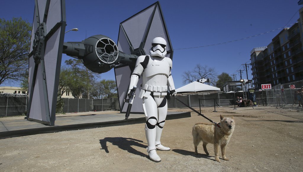 A stormtrooper is in front of a to-scale Star Wars TIE fighter during the South by Southwest Film Festival on March 13, 2016, in Austin, Texas. (AP)