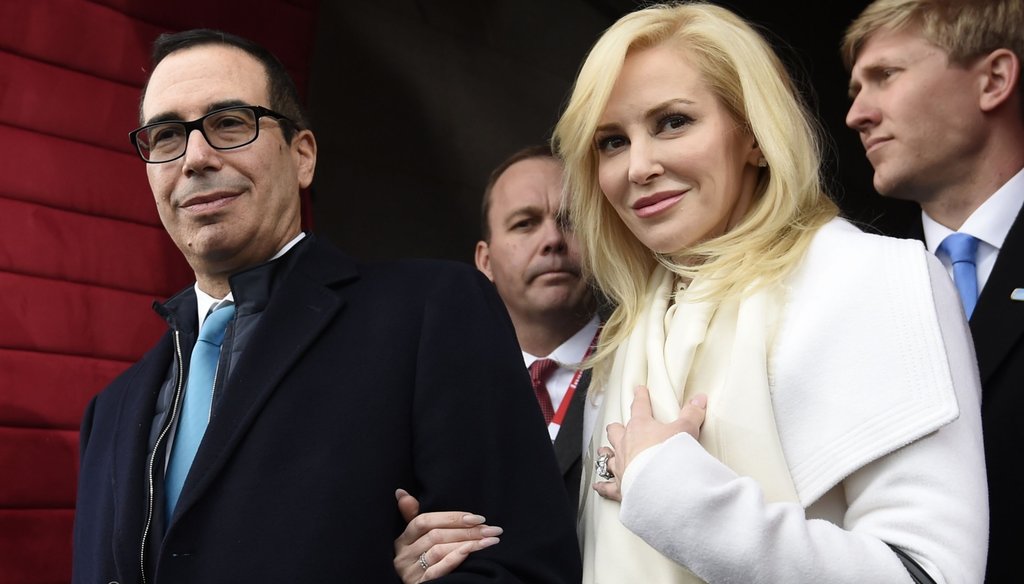 The travels of U.S. Treasury Secretary Steve Mnuchin and his wife, actress Louise Linton, are under scrutiny. (Associated Press)