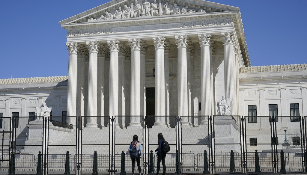 Security fencing surrounds the Supreme Court building on Capitol Hill in Washington, Sunday, March 21, 2021. (AP Image)