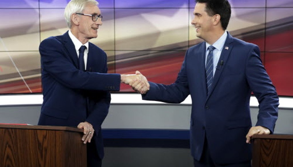 Democratic challenger Tony Evers (left) and Gov. Scott Walker, a Republican, shake hands before the start of their gubernatorial debate hosted by the Wisconsin Broadcasters Association Foundation Oct. 19, 2018, in Madison. (Associated Press)