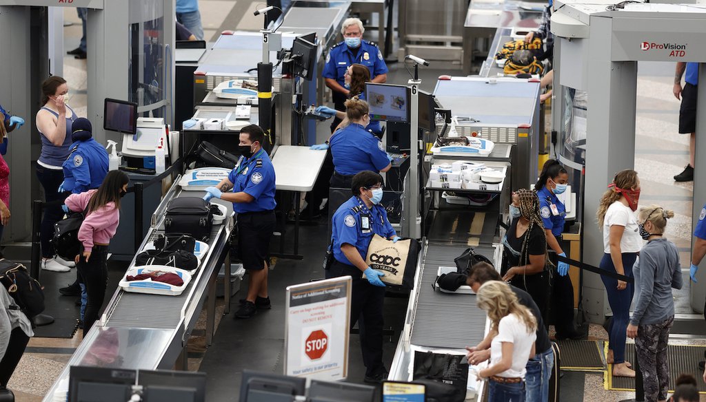 In a June 10, 2020 file photo, airport passengers are processed at a Transportation Security Administration checkpoint at Denver International Airport in Colorado. (AP)