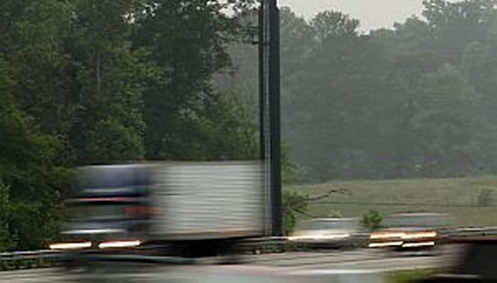 A sign urging voters to approve a tax to pay for transportation projects across metro Atlanta flashes over I-75 in Henry County.