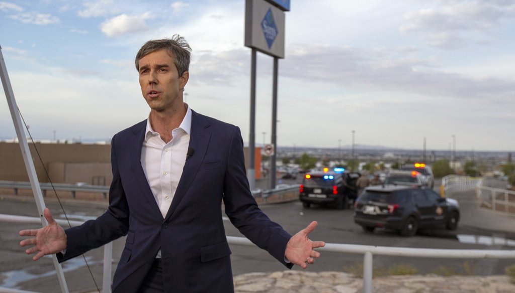 Presidential candidate and former congressman Beto O'Rourke speaks with the media outside the Walmart store in the aftermath of a mass shooting in El Paso, Texas, Sunday, Aug. 4, 2019. (AP Photo/Andres Leighton)