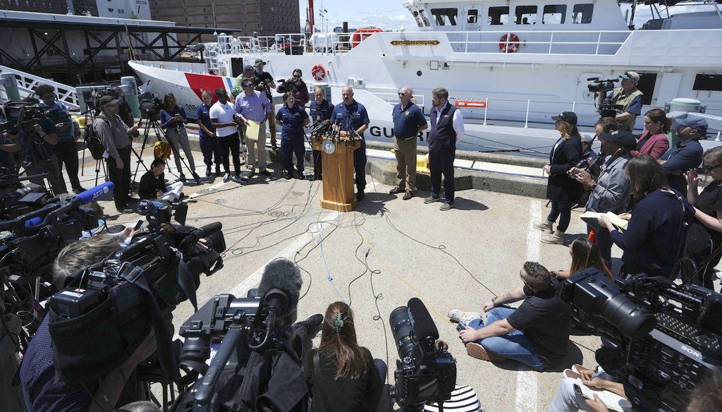 U.S. Coast Guard Capt. Jamie Frederick, center at microphone, faces reporters during a news conference on June 21, 2023, at Coast Guard Base Boston, in Boston. He commented on efforts to find the missing Titan submersible. (AP)