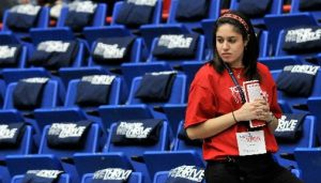 A volunteer prepares for the event "Together We Thrive: Tucson and America," honoring the January 8 shooting victims, at McKale Memorial Center on the University of Arizona campus on January 12, 2011.