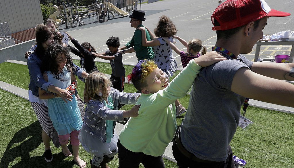 In this Tuesday, July 11, 2017 photo, campers and camp counselors dance at the Bay Area Rainbow Day Camp in El Cerrito, Calif. (AP)