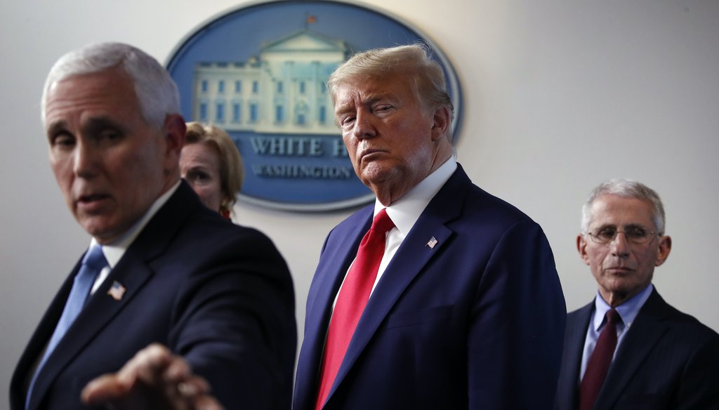 Vice President Mike Pence gestures to a monitor as he speaks about the coronavirus onMarch 31, 2020, as Dr. Deborah Birx, White House coronavirus response coordinator, President Donald Trump and Dr. Anthony Fauci, director of the National Institute of All