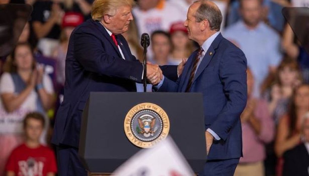 President Donald Trump shakes the hand of Republican Dan Bishop, who's running for Congress in North Carolina against Democrat Dan McCready.