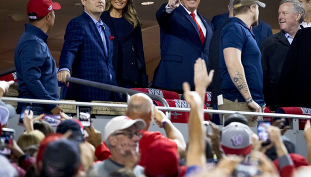 President Donald Trump and first lady Melania Trump, third from left, arrive for Game 5 of the World Series baseball game between the Houston Astros and the Washington Nationals at Nationals Park in Washington, Sunday, Oct. 27, 2019. (AP)
