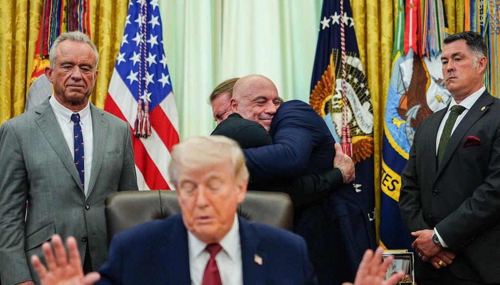 Americans for Ibogaine CEO W. Bryan Hubbard embraces Joe Rogan after President Donald Trump signed an executive order in the Oval Office of the White House, Saturday, April 18, 2026, in Washington. (AP)