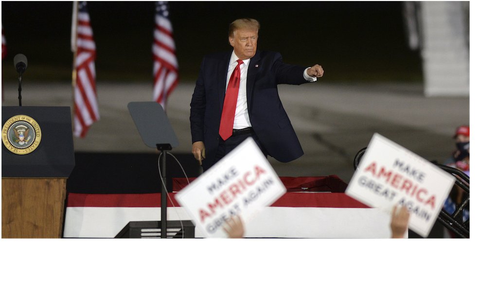 President Donald Trump acknowledges a supporter following a campaign rally at MBS International Airport  in Freeland, Mich. (AP Photo/Jose Juarez)