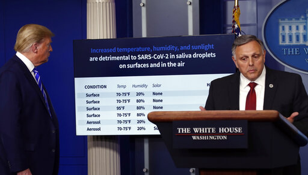 President Donald Trump looks at a chart as Bill Bryan, head of science and technology at the Department of Homeland Security, speaks about the coronavirus in the James Brady Press Briefing Room of the White House, April 23, 2020. (AP)