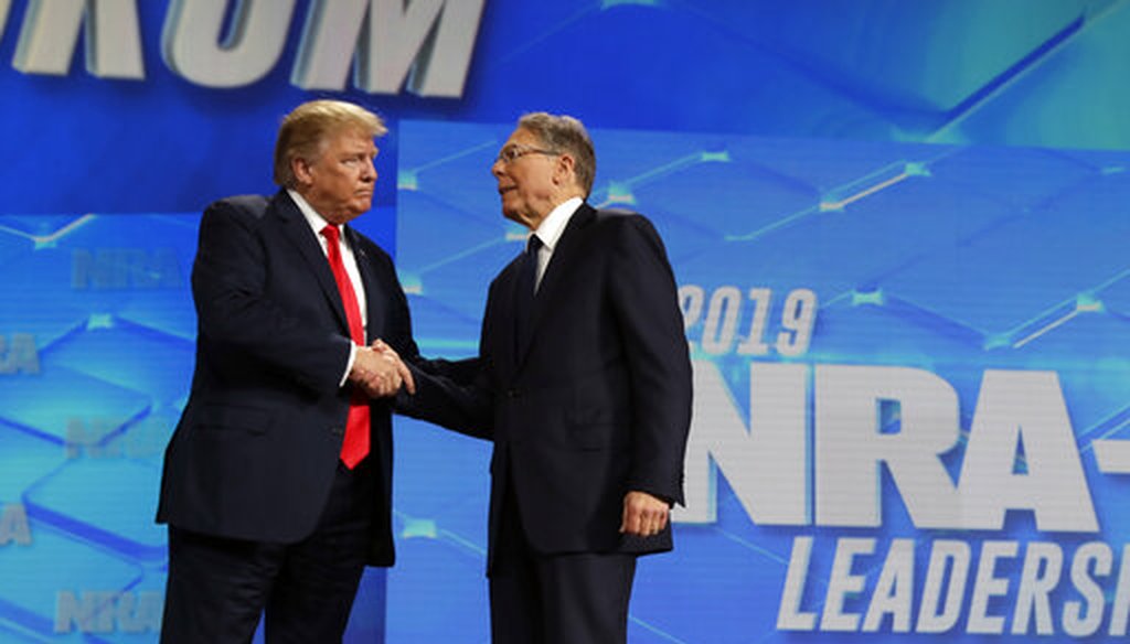 President Donald Trump shakes hands with NRA executive vice president and CEO Wayne LaPierre, has he arrives to speak to the annual meeting of the National Rifle Association, Friday, April 26, 2019, in Indianapolis. (AP)