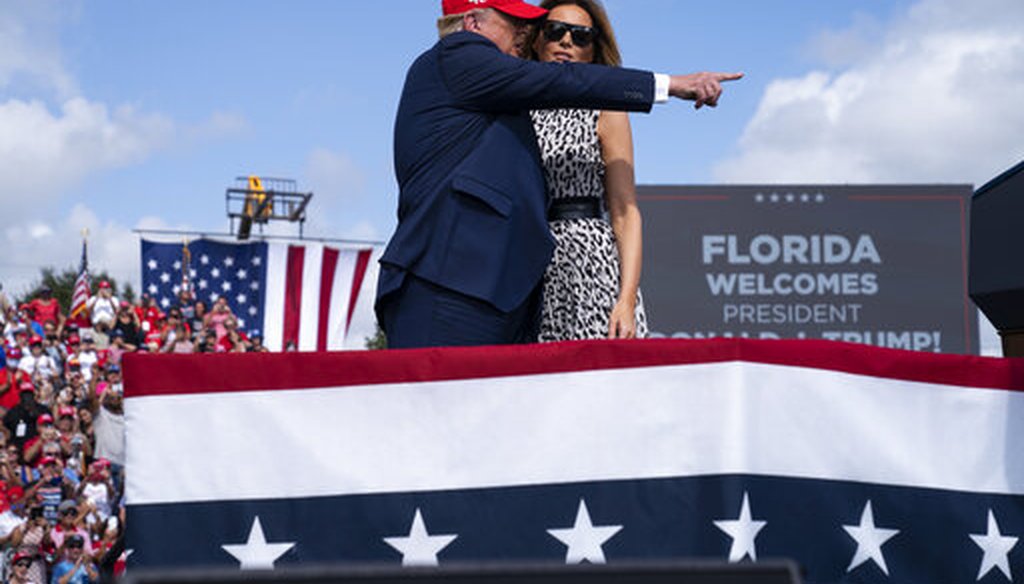 President Donald Trump hugs first lady Melania Trump after she introduced him during a campaign rally outside Raymond James Stadium, Thursday, Oct. 29, 2020, in Tampa. (AP)