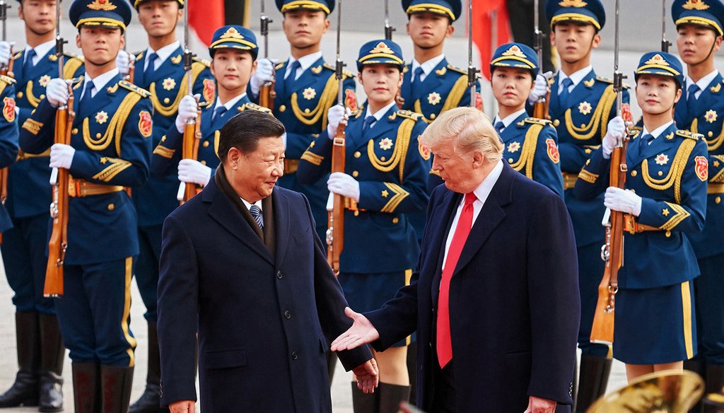 China's President Xi Jinping and U.S. President Donald Trump shake hands on Nov. 9, 2017, during a meeting in Beijing. The two are now at the center of a trade war with tariffs imposed on both sides.  (Artyom Ivanov/Tass/Abaca Press/TNS)
