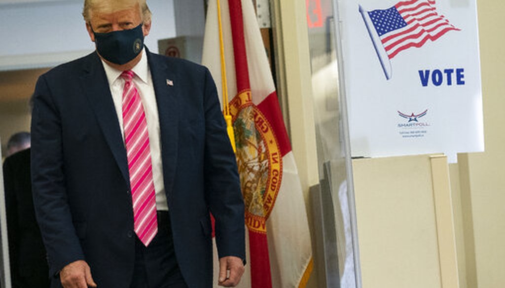 President Donald Trump walks to speak with reporters after voting at the Palm Beach County Main Library, Saturday, Oct. 24, 2020, in West Palm Beach, Fla. (AP)